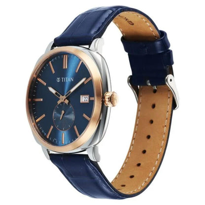 Titan watch with blue strap and rose gold accents on a white background