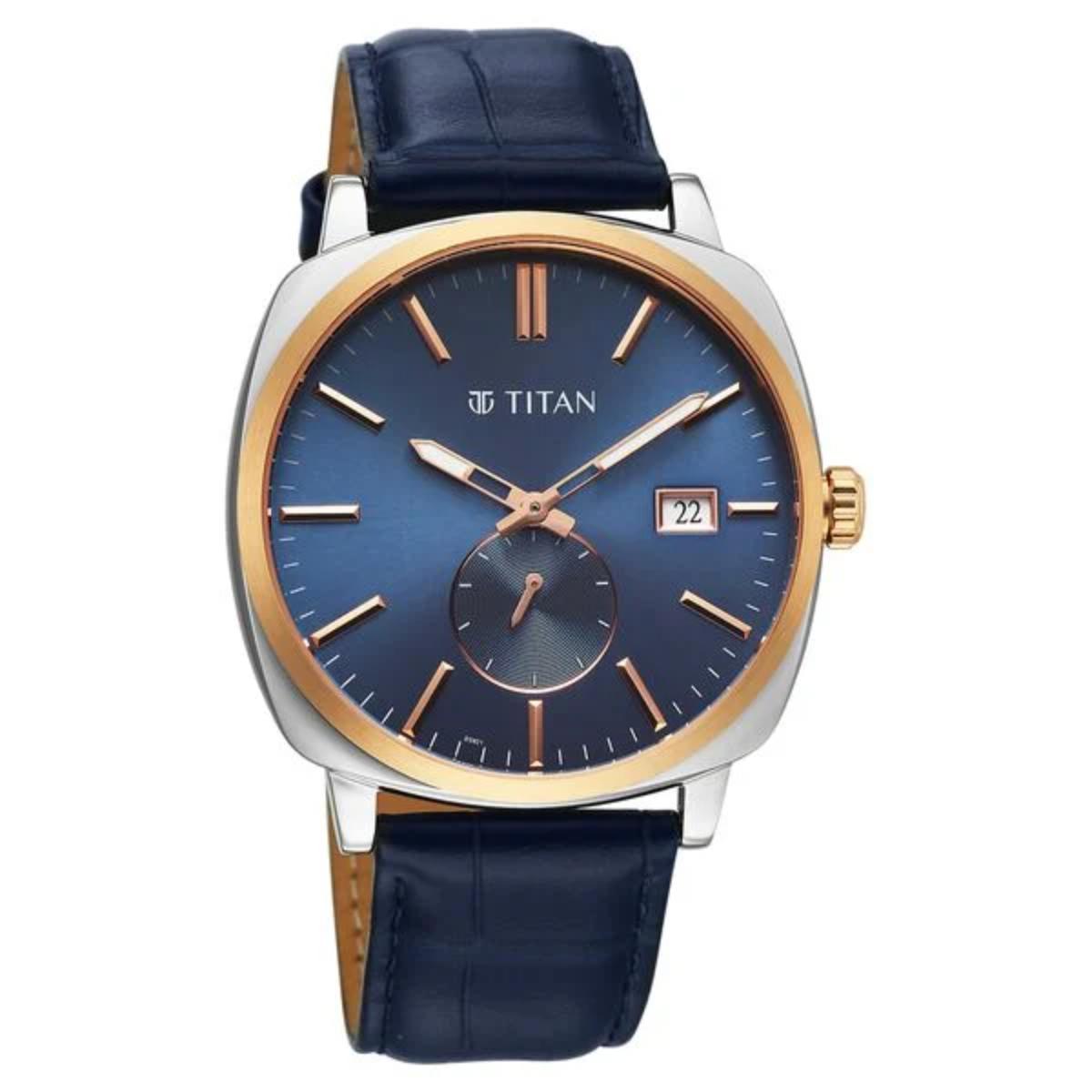 Titan watch with blue dial and navy leather strap on a white background