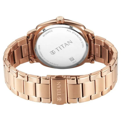 Rose gold Titan watch on a white background