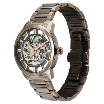 Titan watch with metallic band on a white background