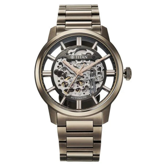 Titan watch with metallic band and visible mechanical components on a white background