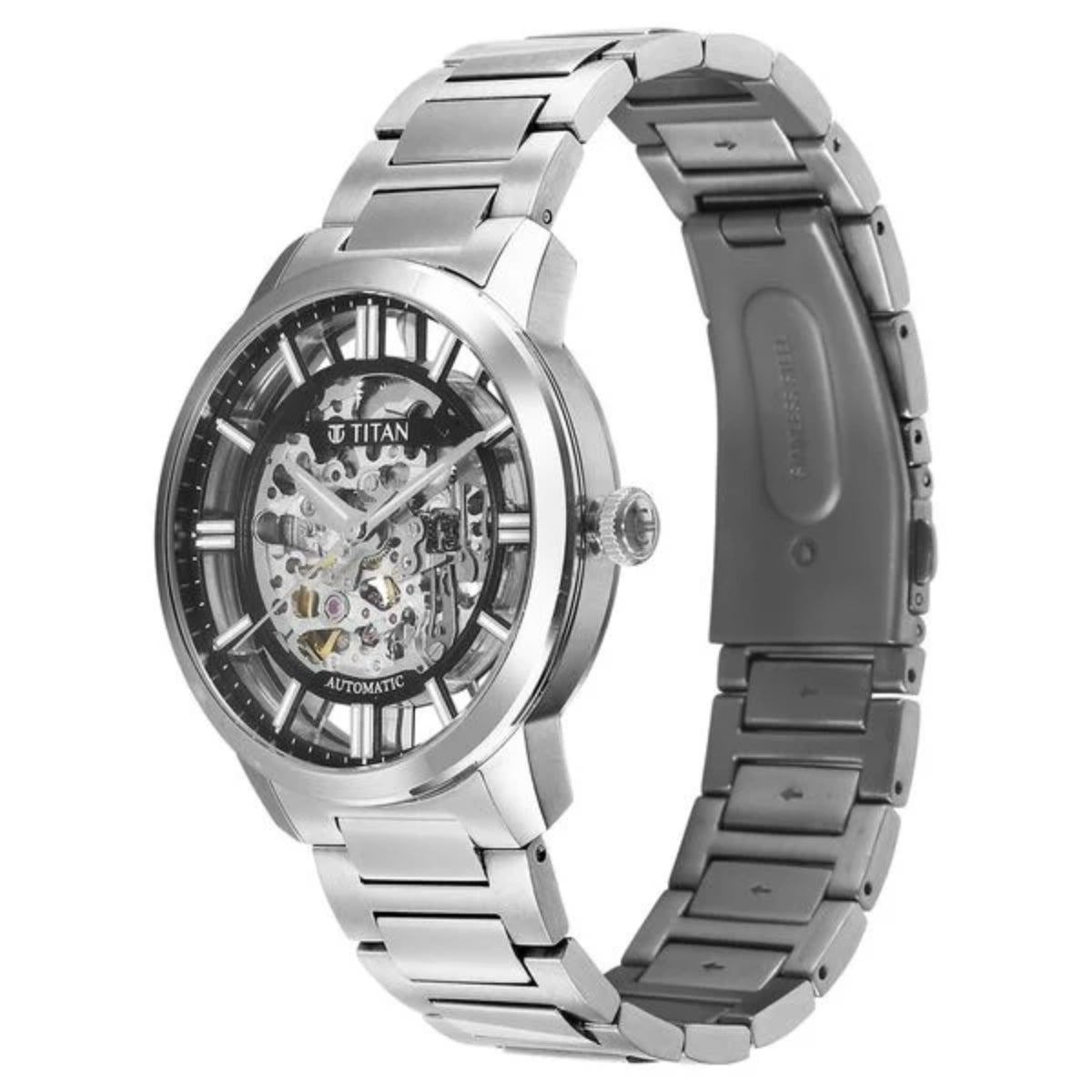 Silver Titan watch with a detailed face on a white background
