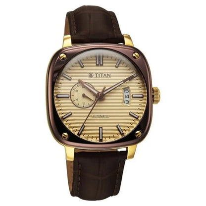 Titan watch with brown leather strap and gold case on white background