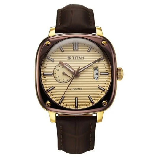 Titan watch with gold case and brown leather strap on a white background