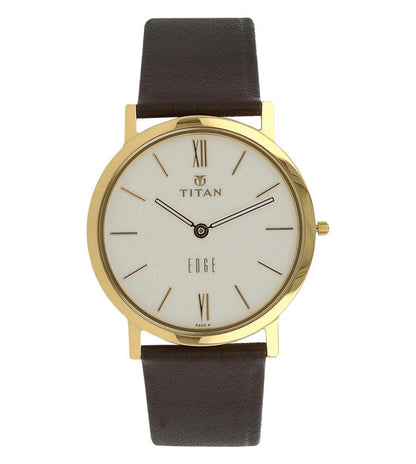 A TITAN Edge analog watch for men with a white dial, gold case, and brown leather strap.