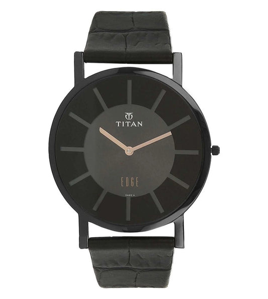 A TITAN Edge Revamp slim analog watch for men with a black dial and black leather strap.