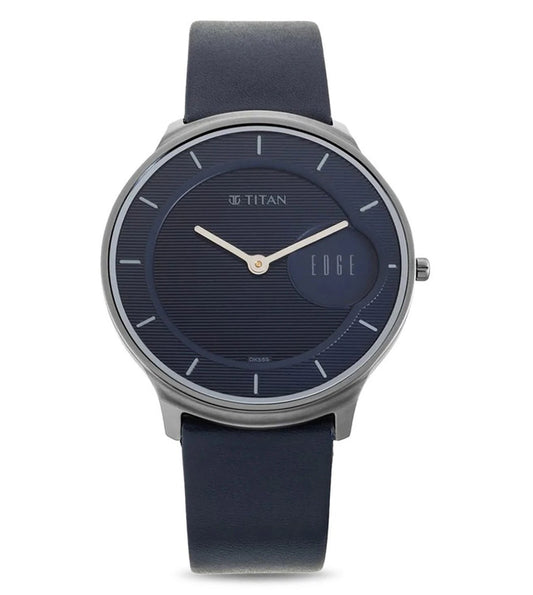 A blue TITAN Edge analog watch with a stainless steel case and a genuine leather strap.