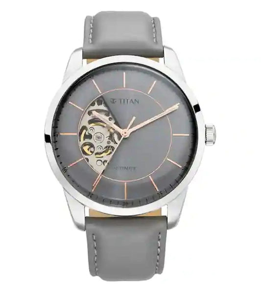A TITAN Automatics analog watch for men with a grey dial and a grey leather strap.