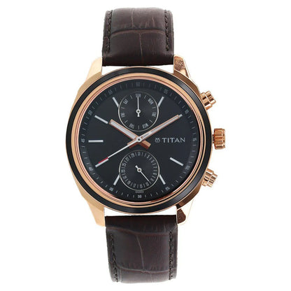 Titan watch with black dial and brown leather strap on a white background