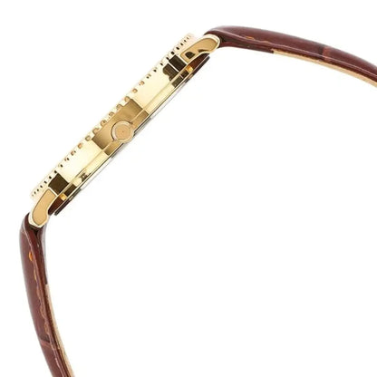 Gold and brown eyeglass frame on a white background