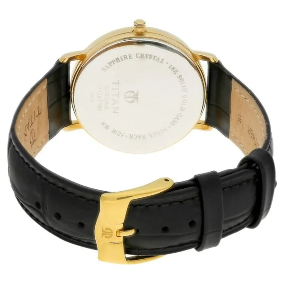 Watch with black leather strap and gold casing on a white background