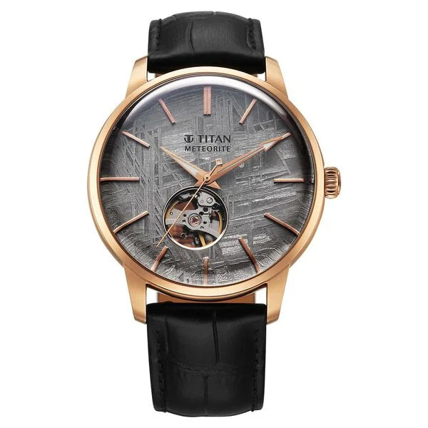 A Titan Stellar Automatic Watch with a grey dial, black leather strap, and a stainless steel case.