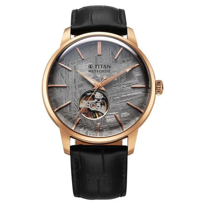 A Titan Stellar Automatic Watch with a grey dial, black leather strap, and a stainless steel case.