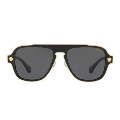 Sunglasses with gold frame and dark lenses on a white background