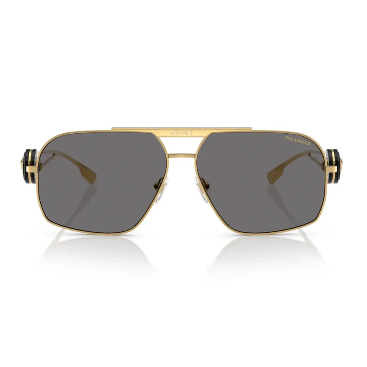 Gold-framed sunglasses with dark lenses on a white background