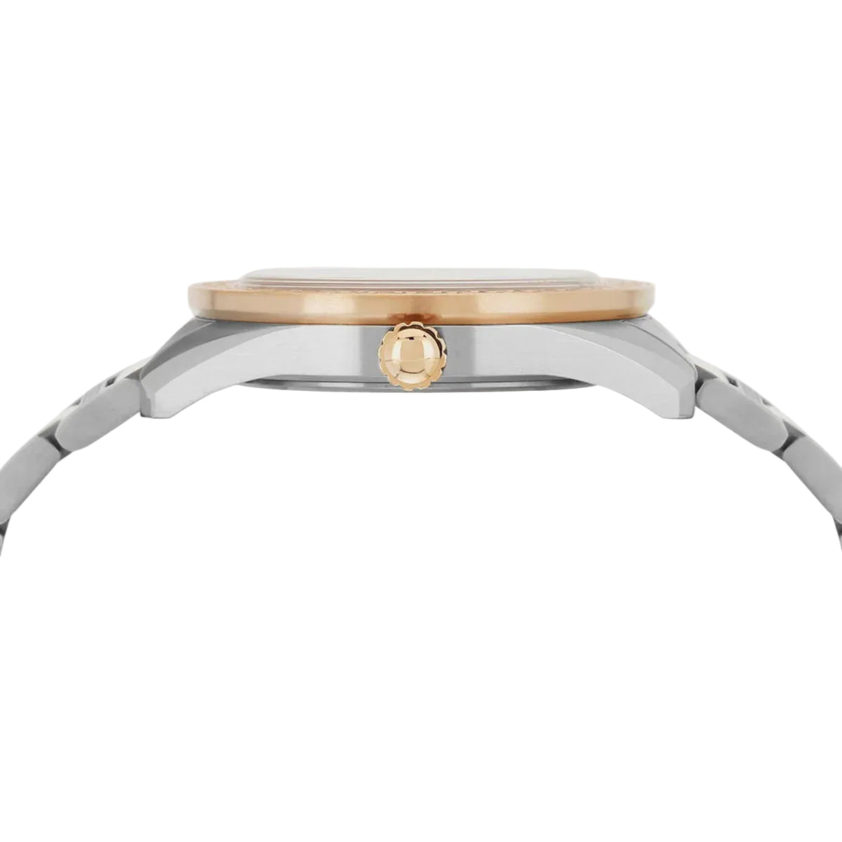 Close-up of a watch with a gold and silver band on a light gray background