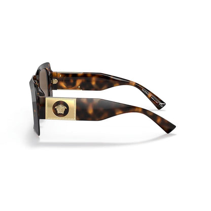 Sunglasses with tortoiseshell frame and gold accents on a white background