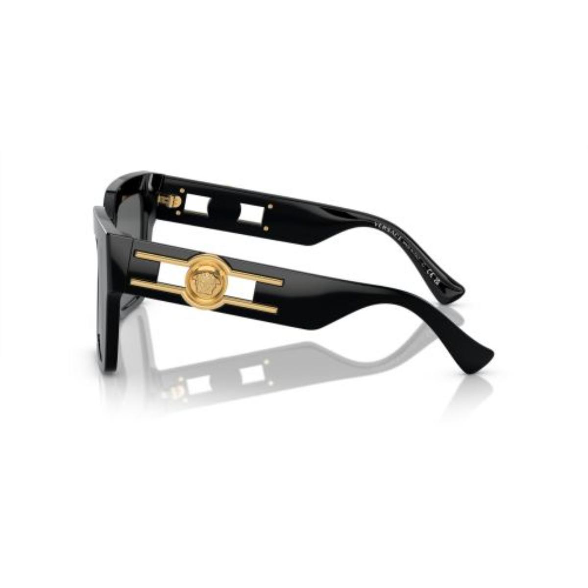 Black sunglasses with gold accents on a white background