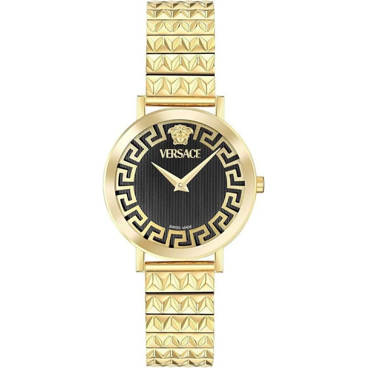 Gold Versace watch with black face on a white background