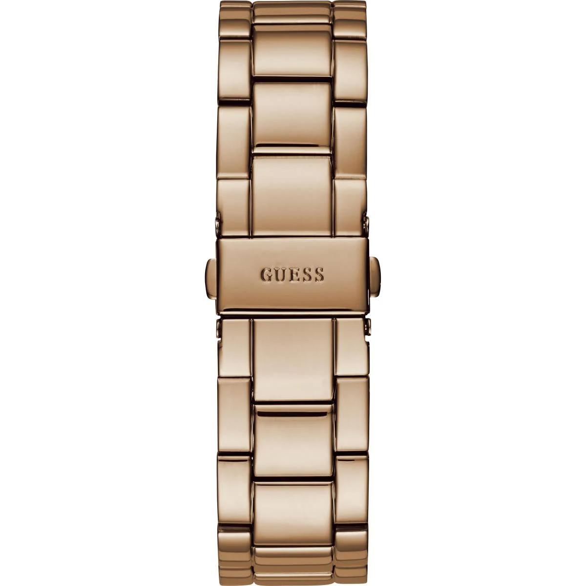 Gold watch with 'GUESS' branding on a white background