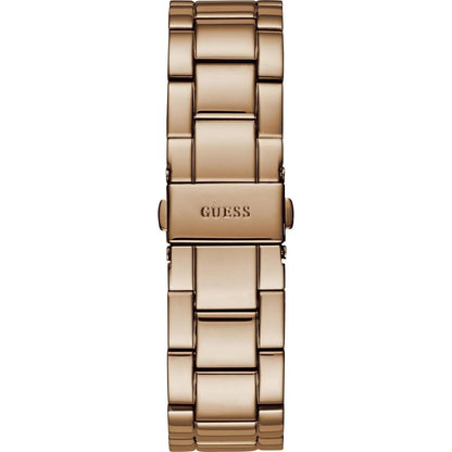 Gold watch with 'GUESS' branding on a white background