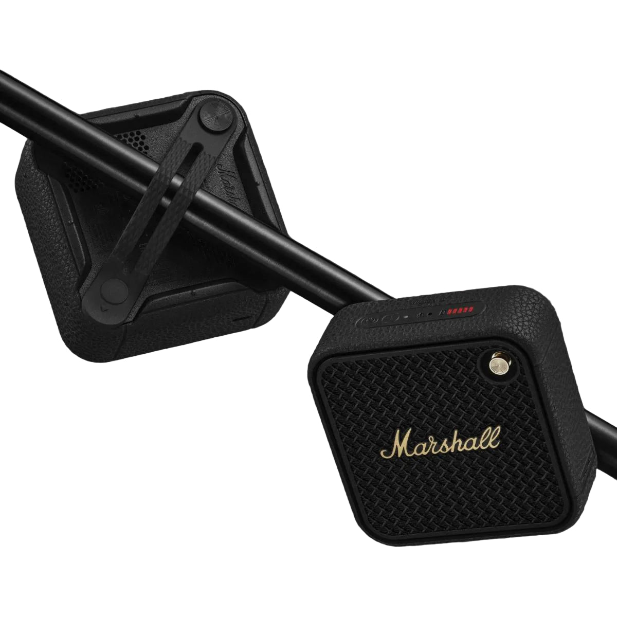 Marshall speaker mounted on a motorcycle handlebar against a dark background