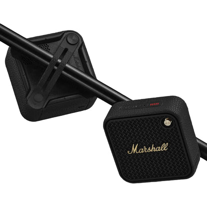Marshall speaker mounted on a motorcycle handlebar against a dark background