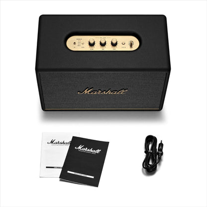 Marshall speaker with cables and manual on a white background
