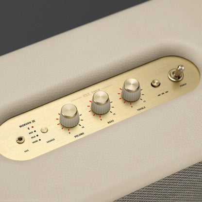Control panel with knobs and switches on a beige surface