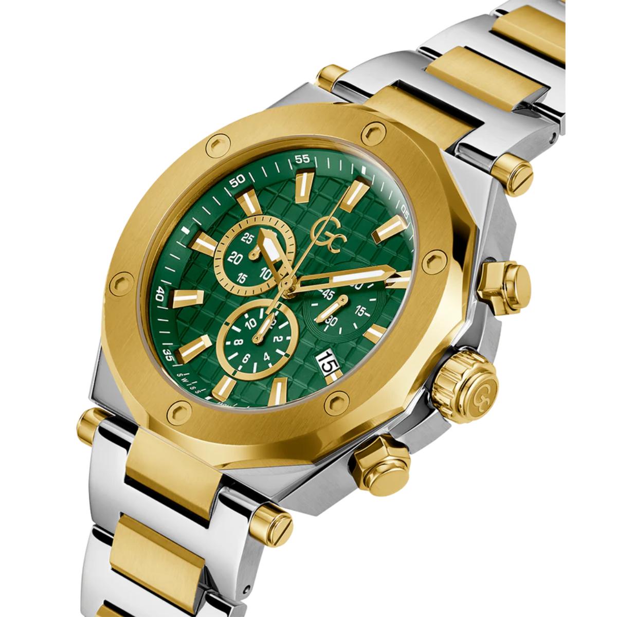 Gold and silver watch with green face on a white background