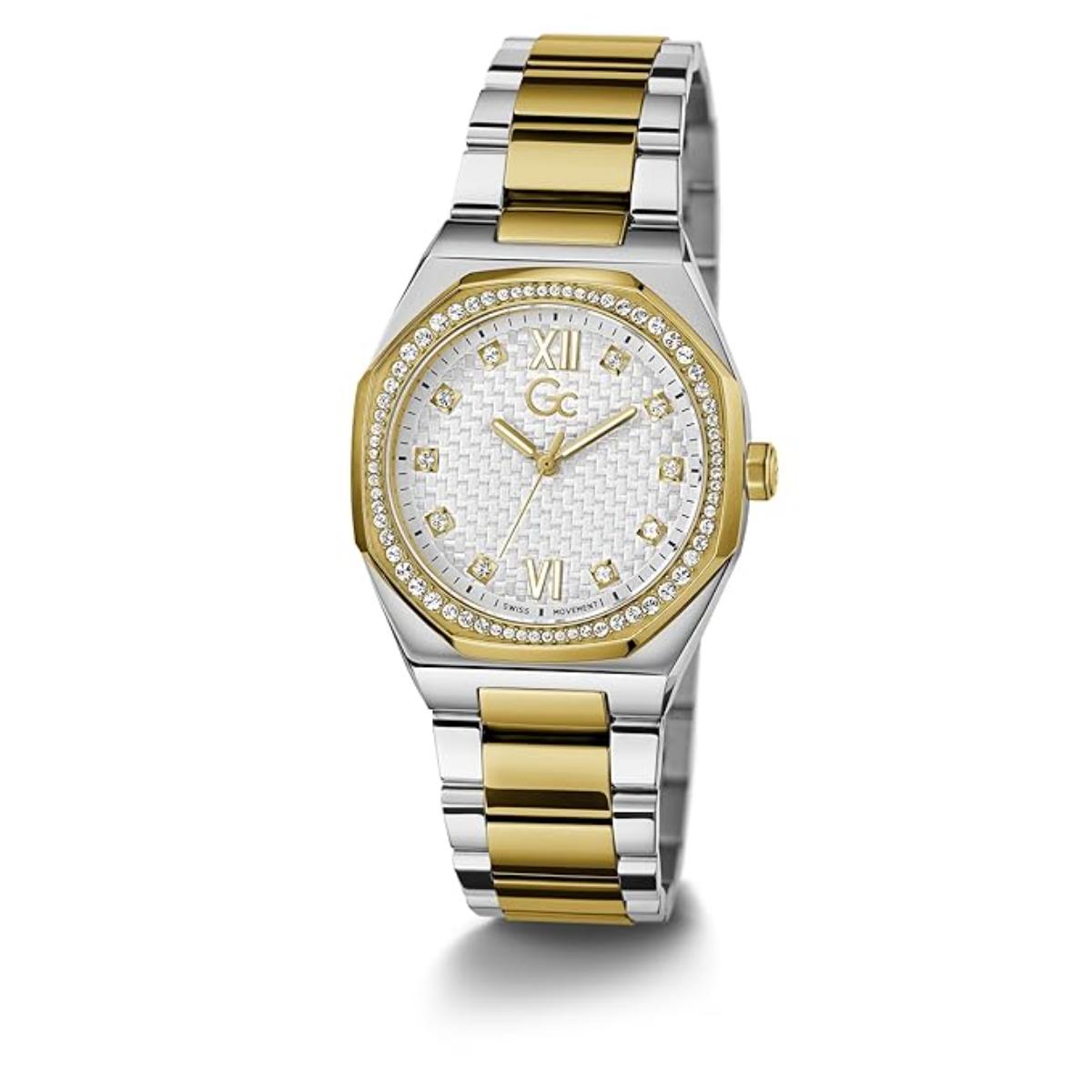Two-tone gold and silver watch with a white face on a white background