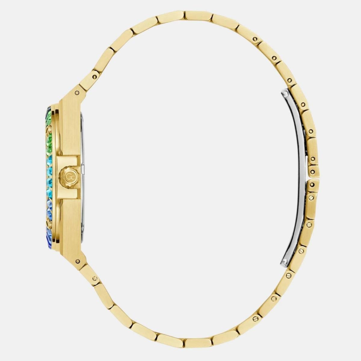 Gold watch strap with colorful gemstones on a white background