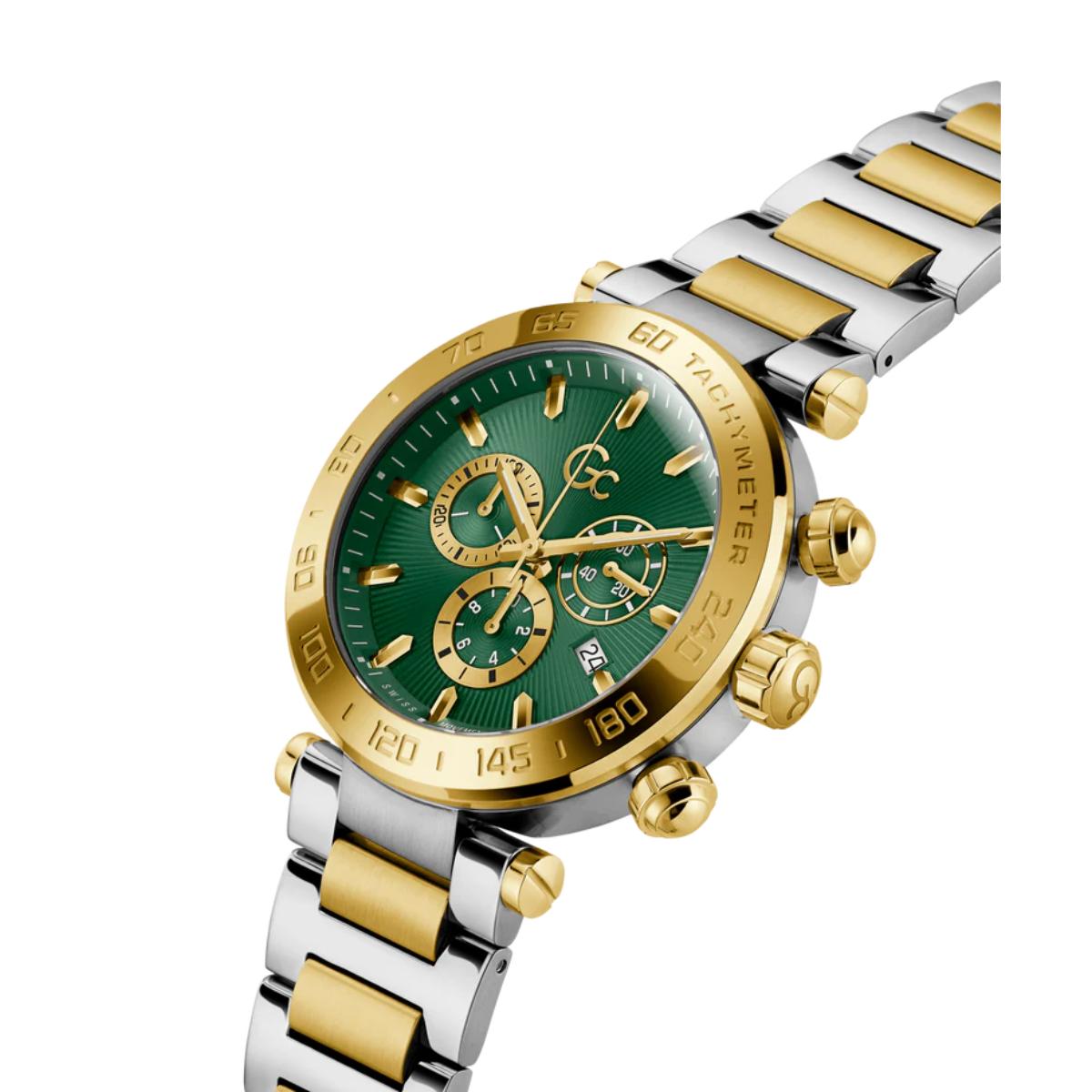 Two-tone silver and gold watch with a green face on a white background