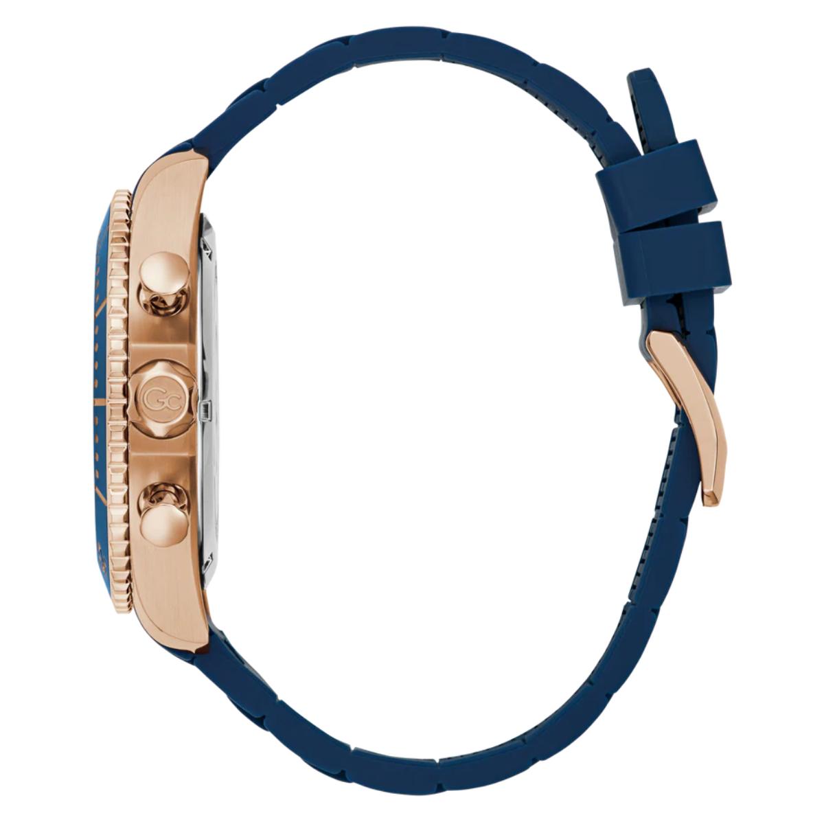 Watch with blue strap and rose gold case on a white background