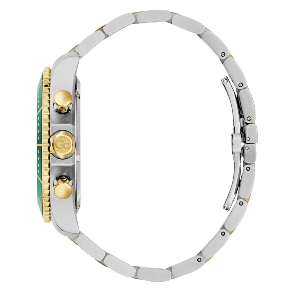 Close-up of a watch with a silver band and green face on a white background