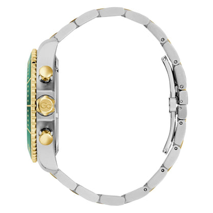 Close-up of a watch with a silver band and green face on a white background