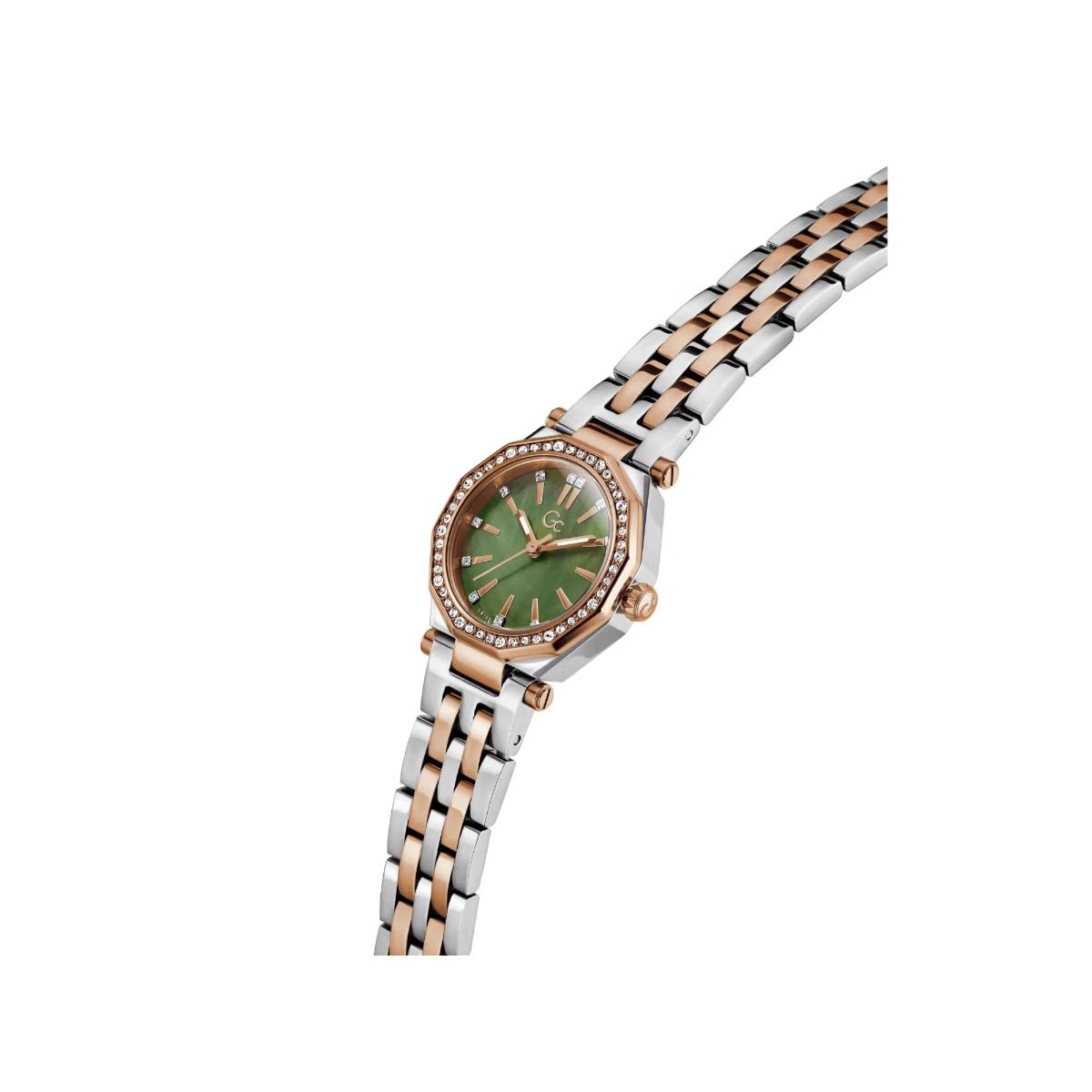 Wristwatch with a two-tone metal strap and green dial on a white background