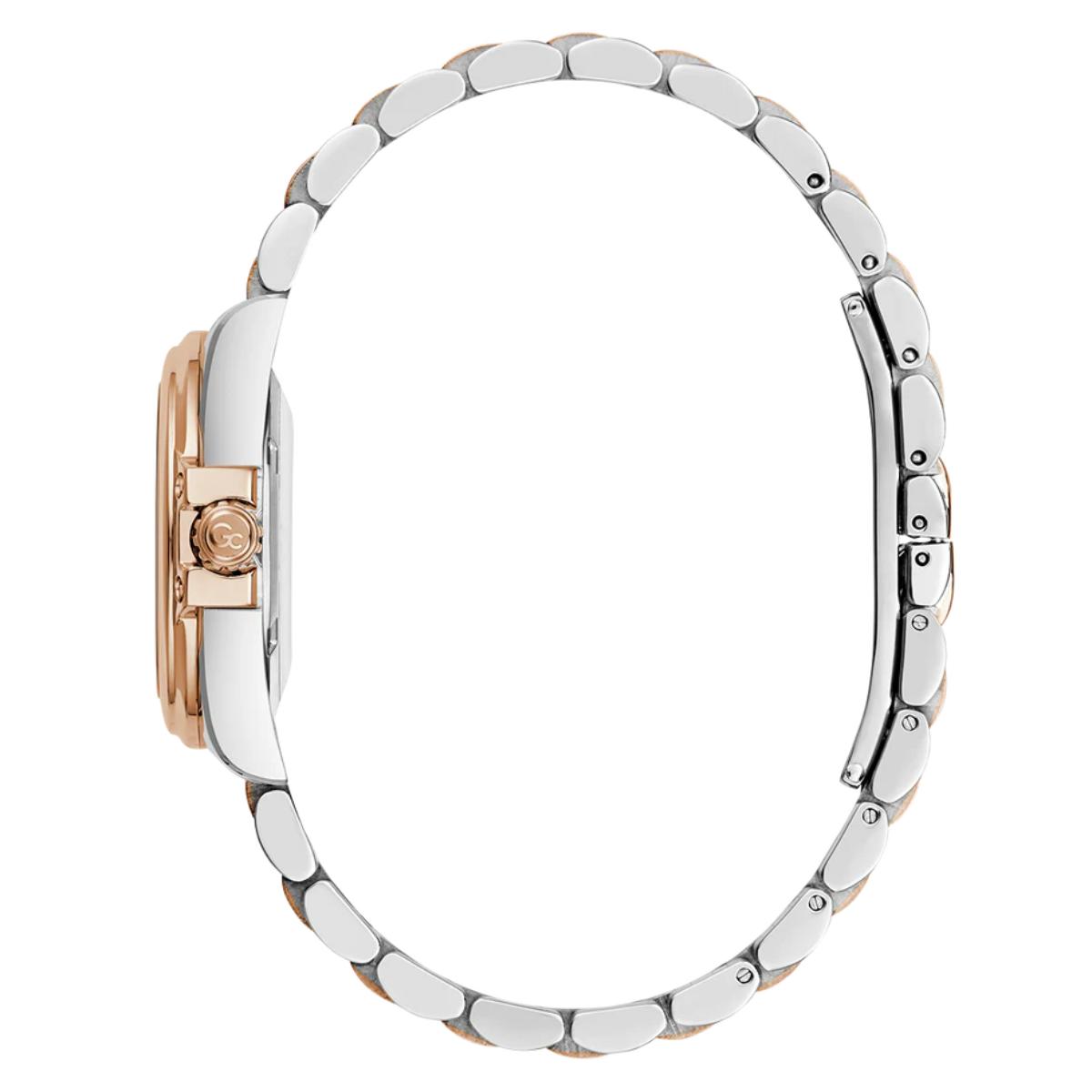 Close-up of a watch with a silver band and rose gold case on a white background