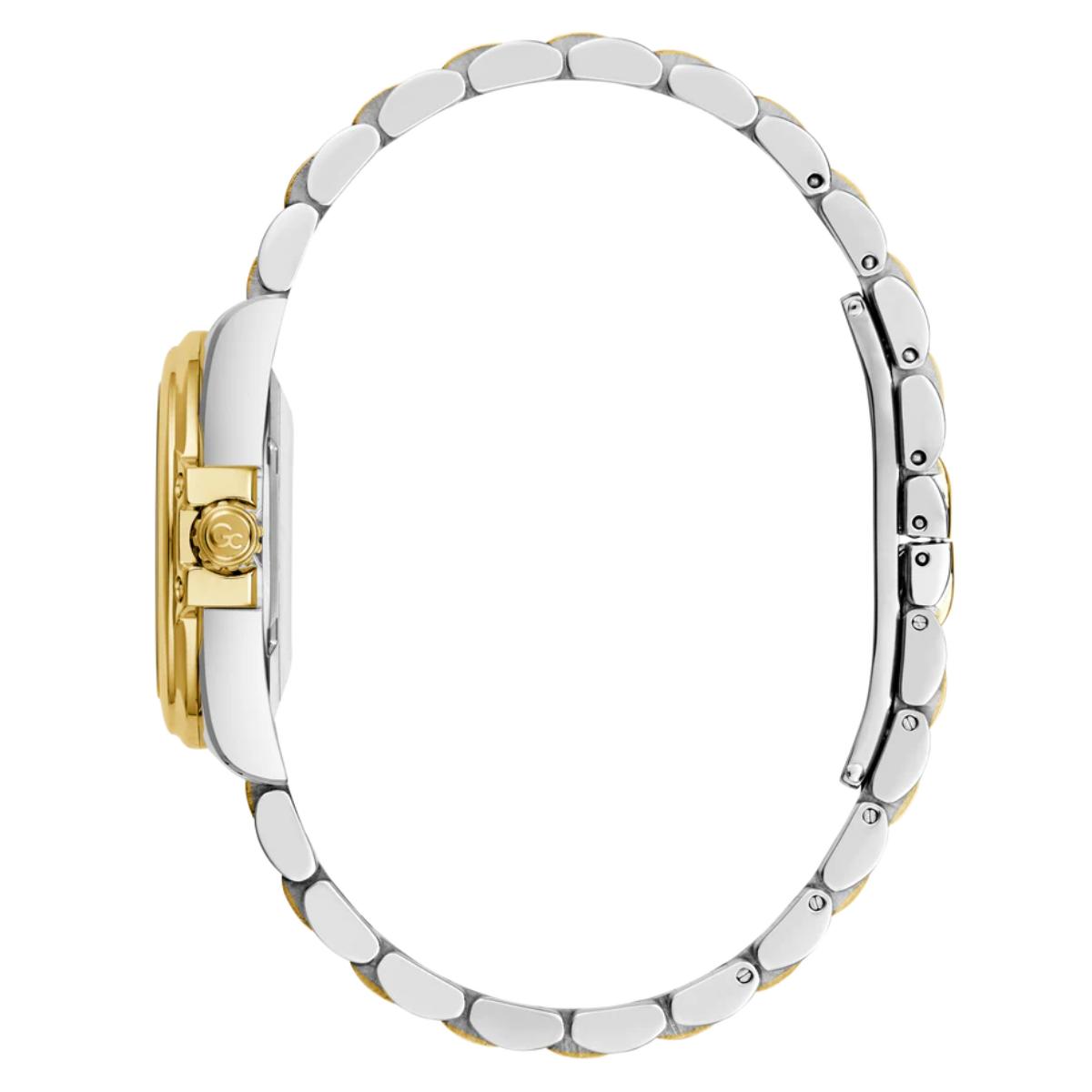 Close-up of a watch with a gold and silver band on a white background