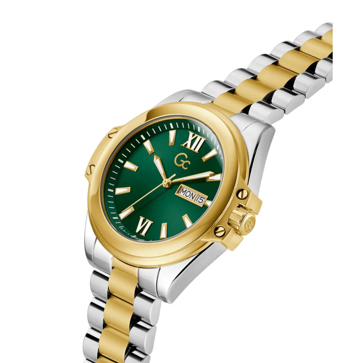 Two-tone gold and silver watch with a green dial on a white background