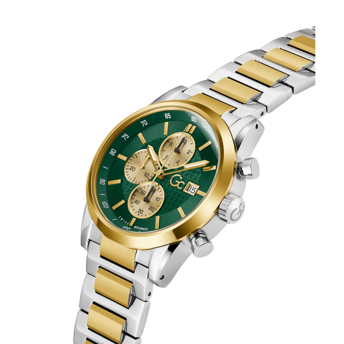 Wristwatch with green face and gold accents on a white background