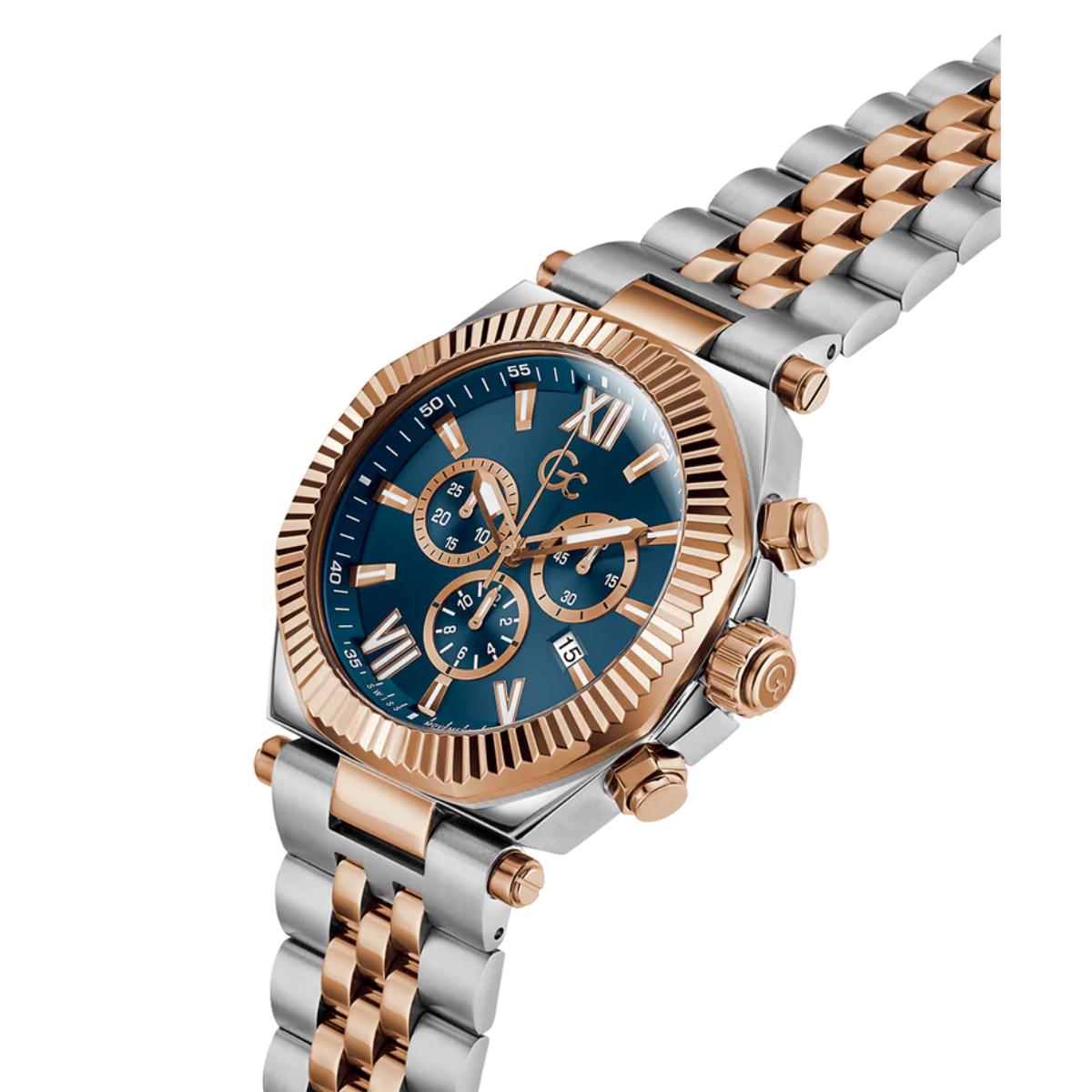 Luxury watch with a blue face and rose gold accents on a white background