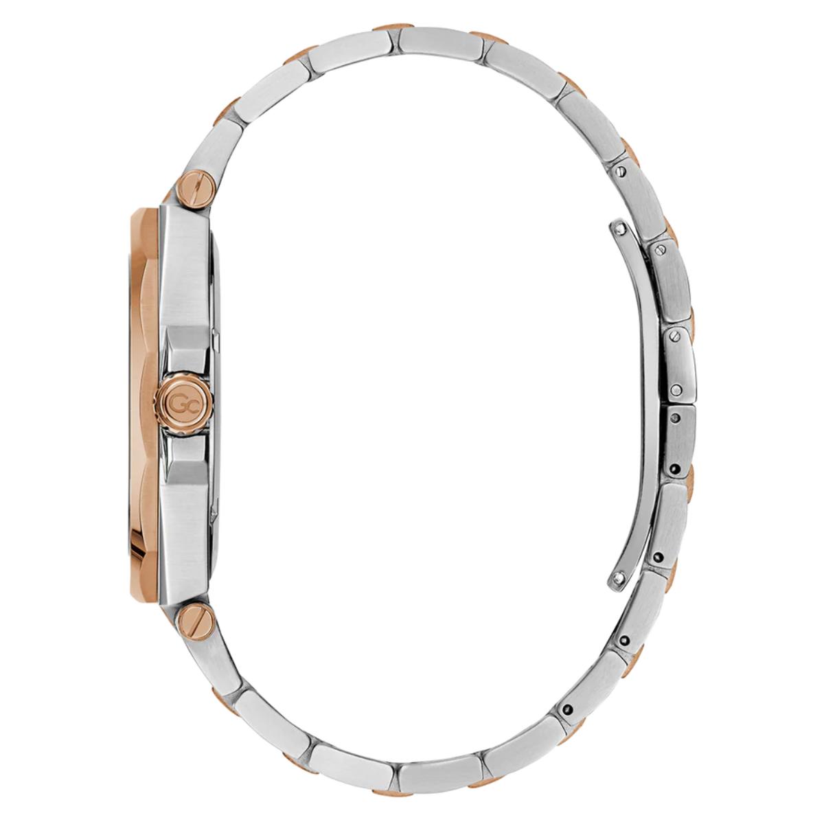 Close-up of a watch with a metal band on a white background