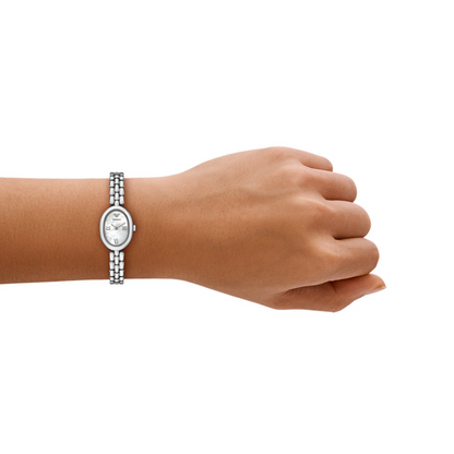 Hand wearing a silver watch on a white background