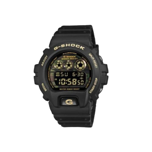 A black G-Shock digital watch with gold accents on the bezel, buttons, and display text, shown against a solid black background.