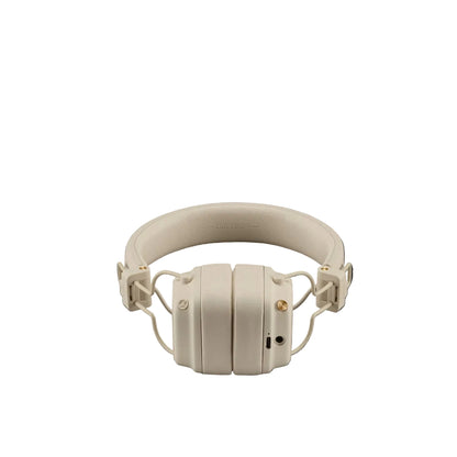 Beige headphones on a dark gray background