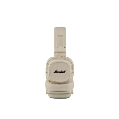 Beige Marshall headphones on a dark gray background